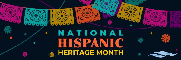 Multiple colors of paper decorations with the words National Hispanic Heritage Month