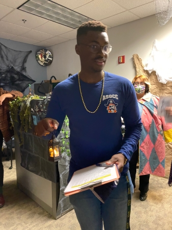 Student representative Thato Mothobi tours the Student Equity display