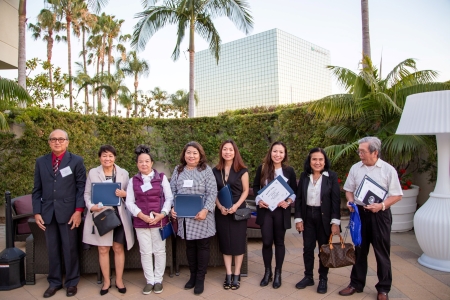 Scholarship recipients at an outdoor ceremony.